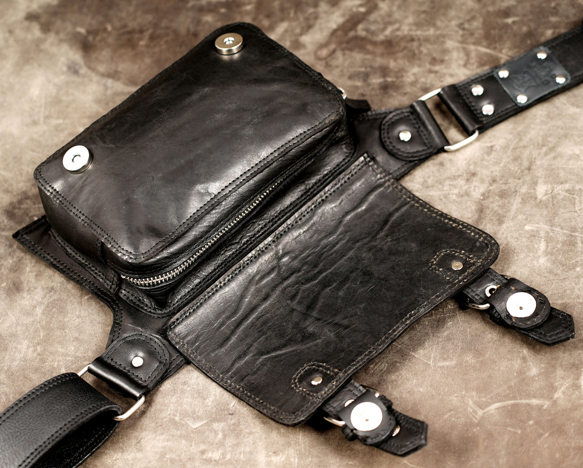 Utility leather hip bag with buckles, full flat lay view