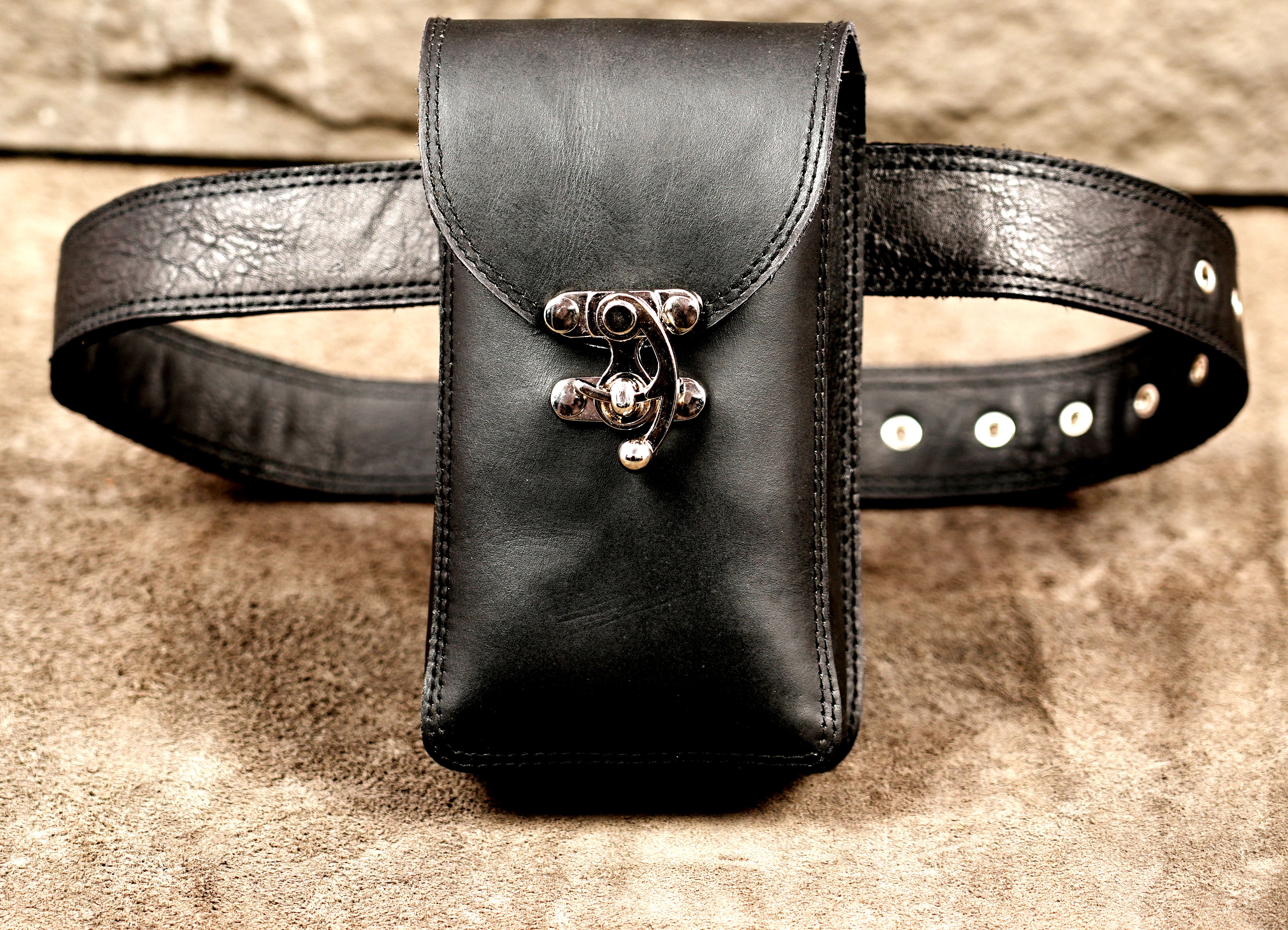 Vertical leather phone case with ornate silver clasp
