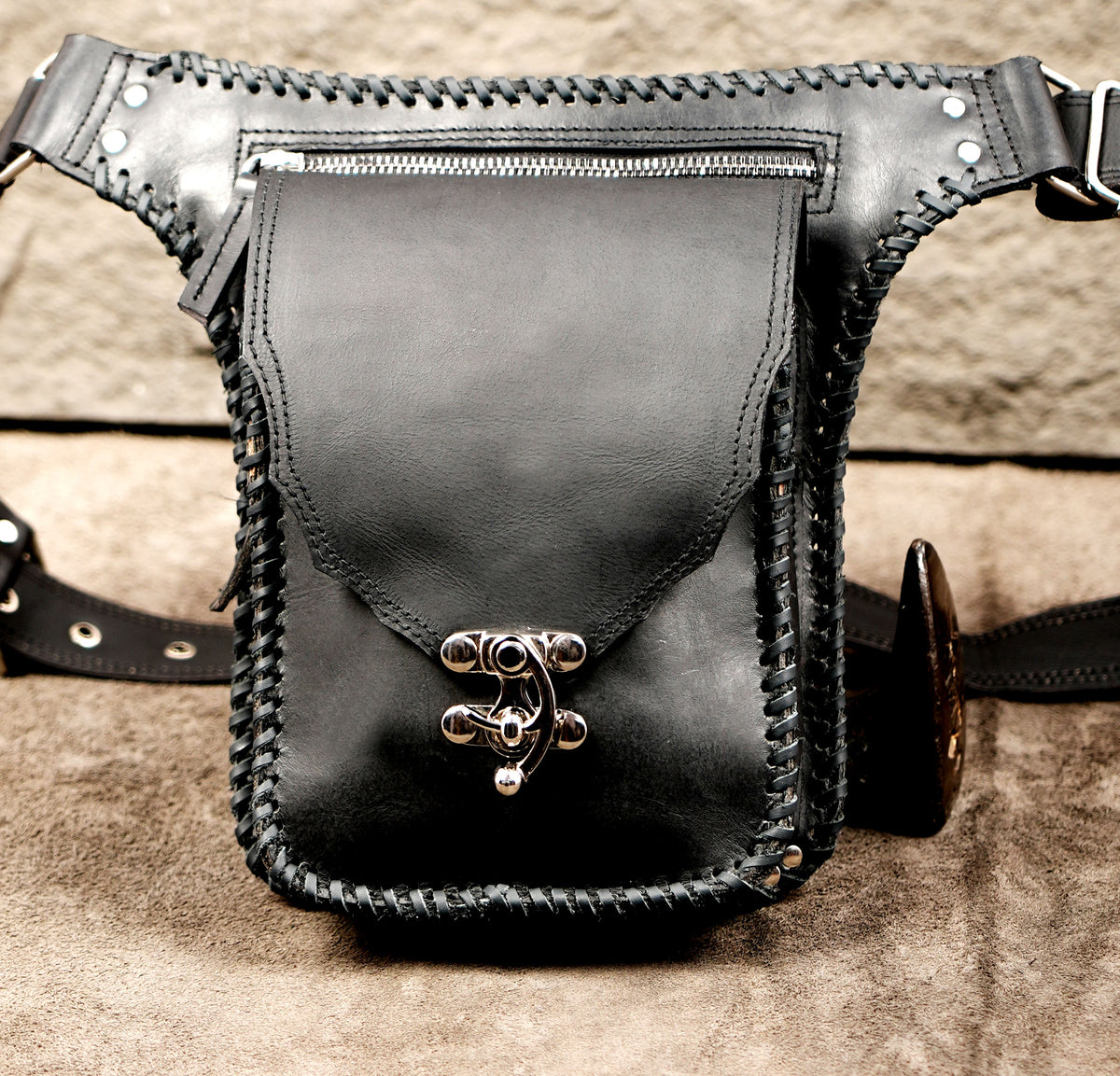 Western leather bag with whipstitch trim, top flat lay view
