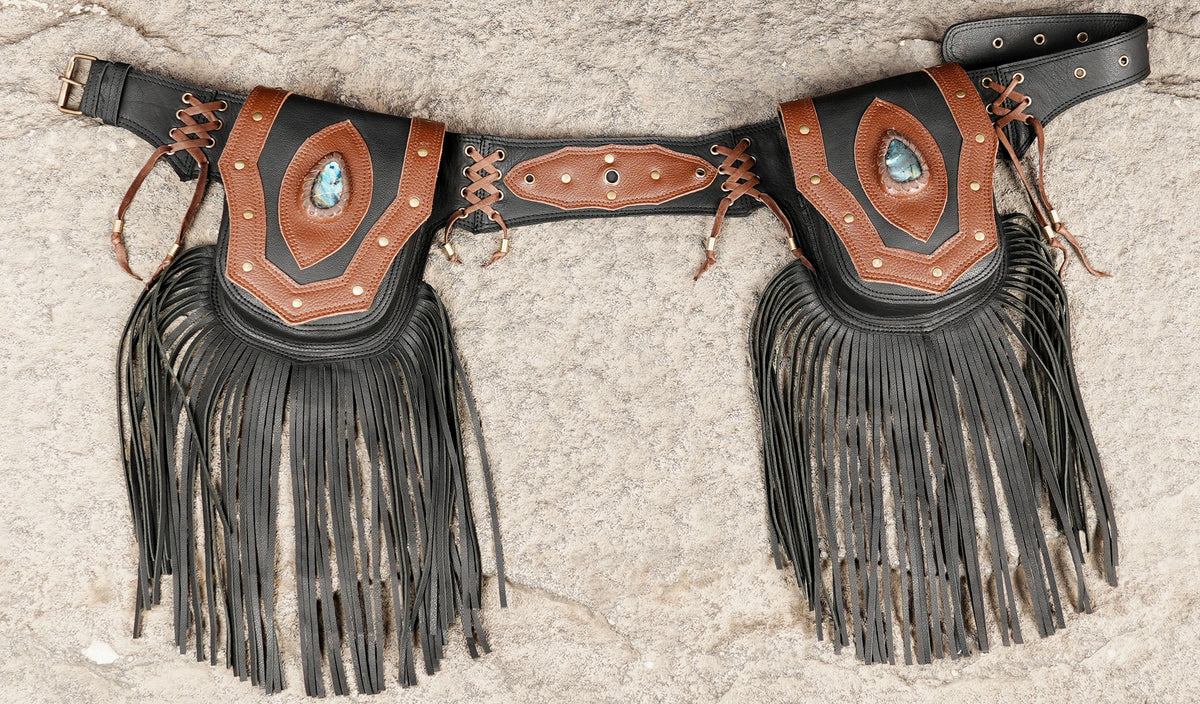 Western leather hip belt with long fringe, flat lay view