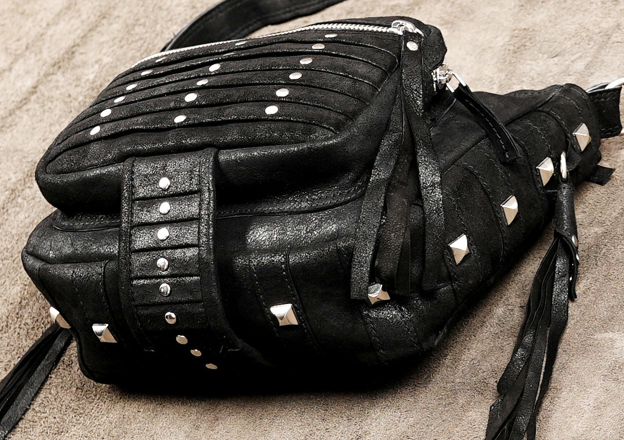 Western leather purse with silver studs and fringe trim