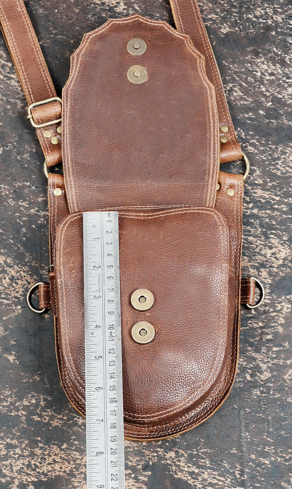 Brown utility holster harness with two rounded pockets and adjustable straps