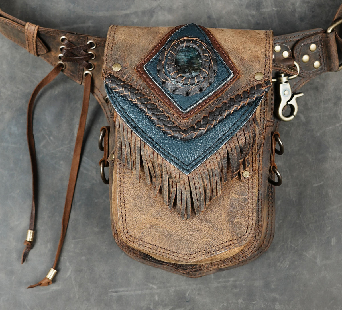 Handmade leather hip pack with braided detailing and front gemstoneHandmade leather hip pack with braided detailing and front gemstone
