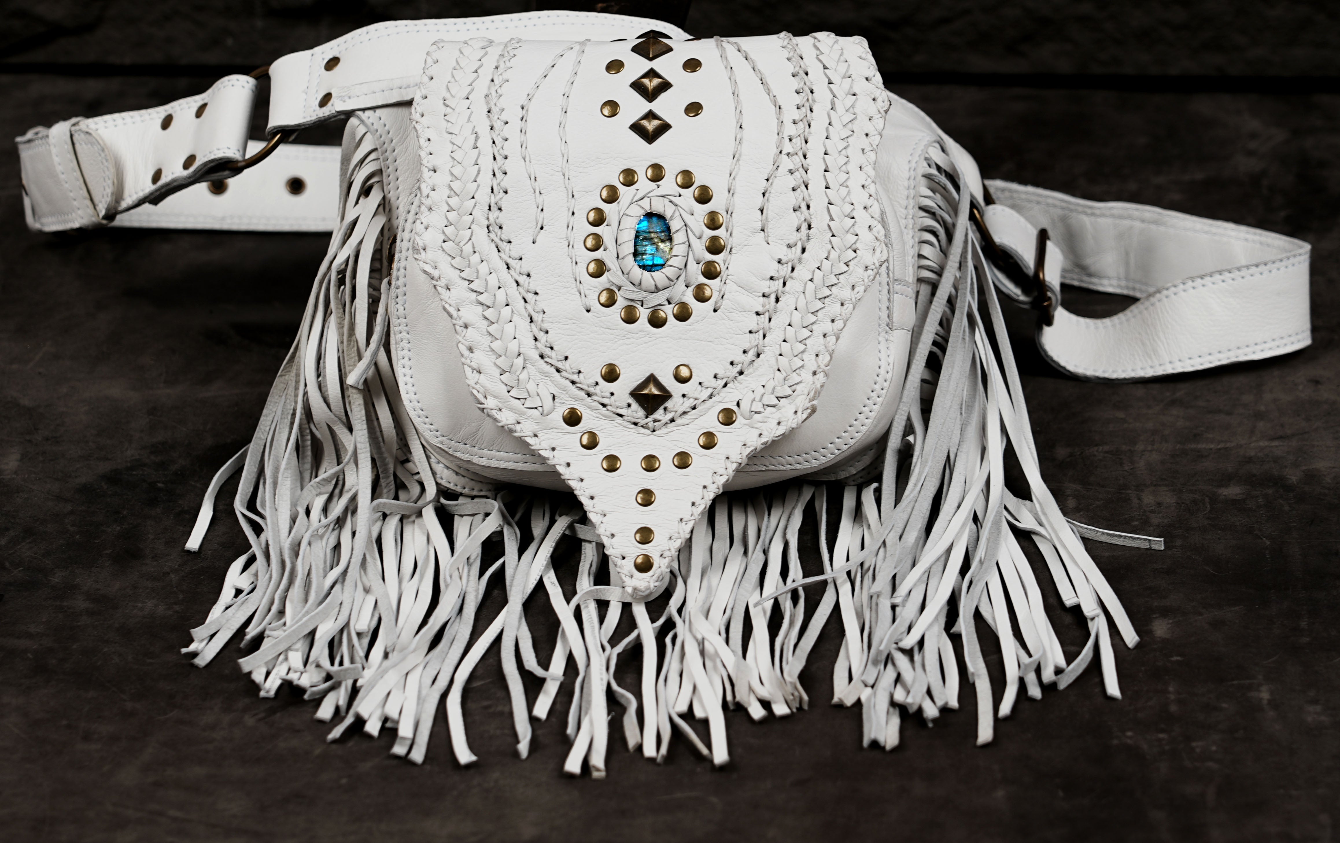 White leather fanny pack with gemstone and stitched detailing