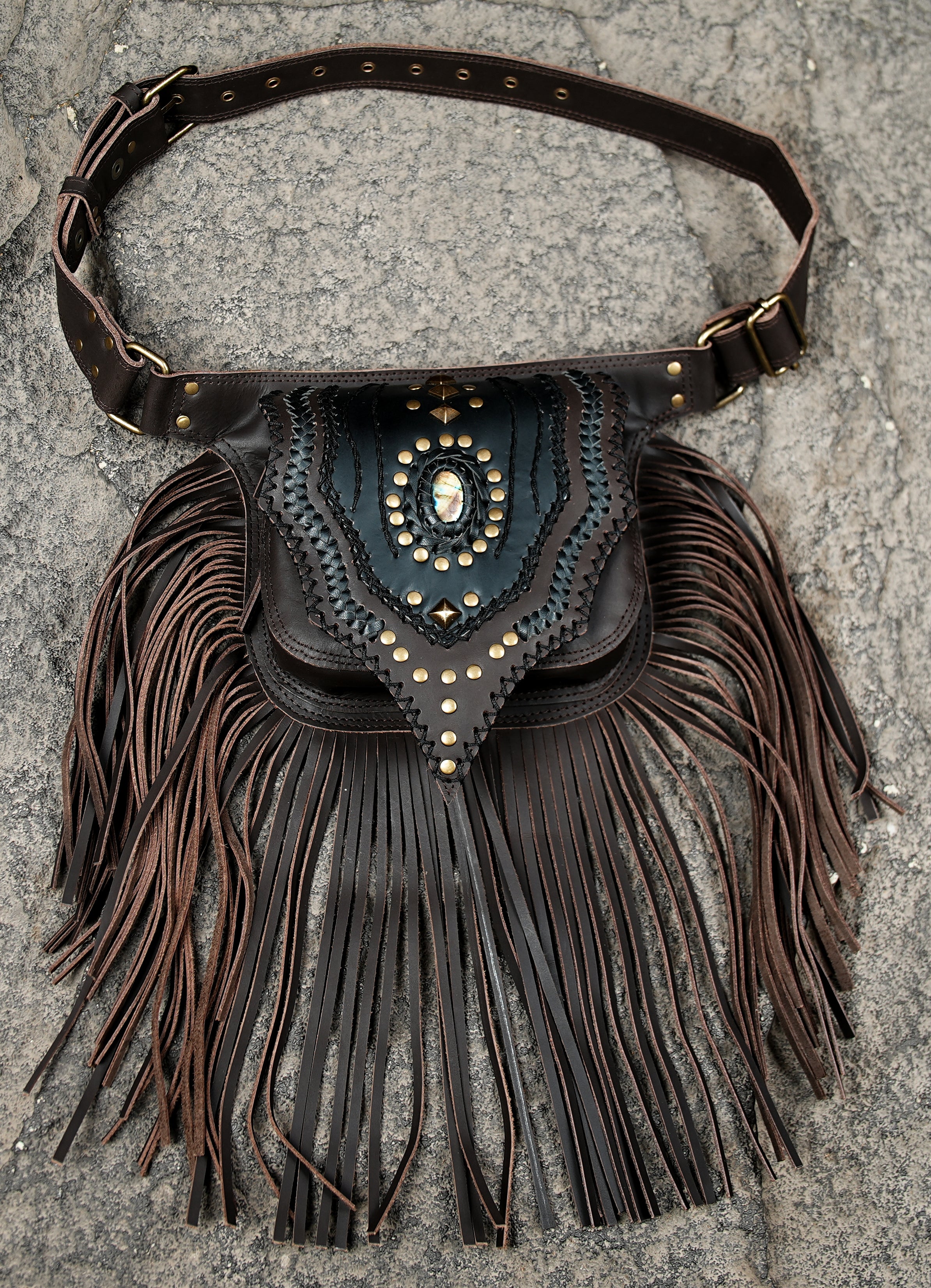 Women’s statement waist bag with white fringe and brass accents