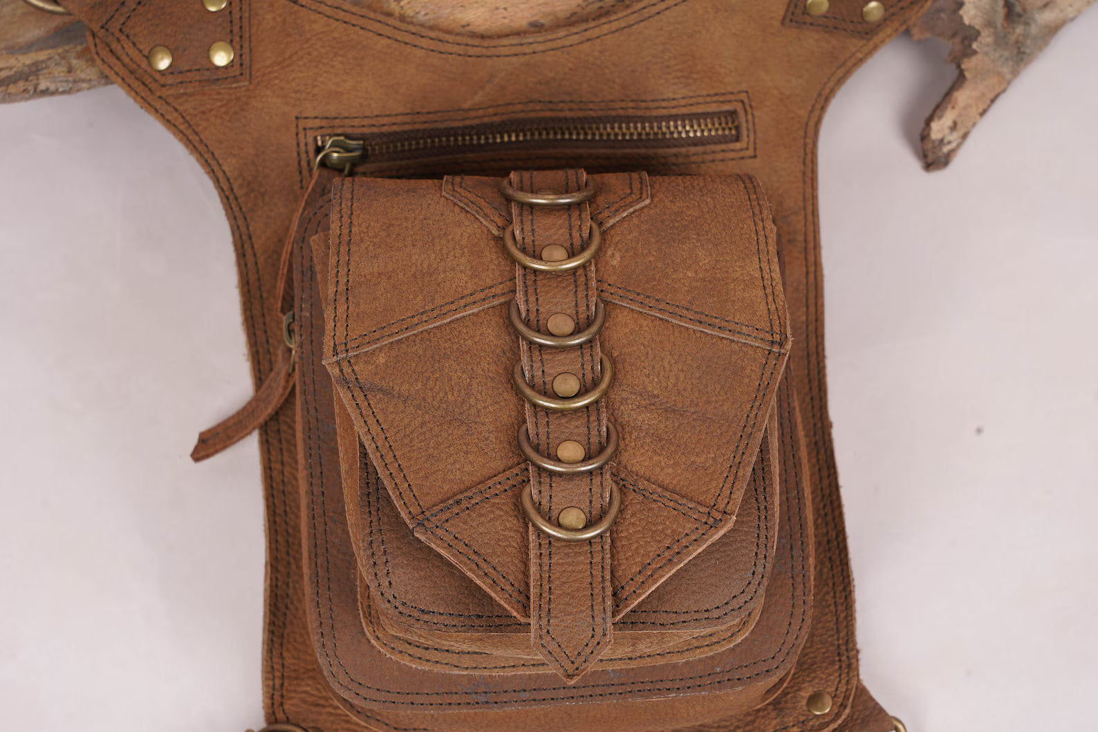 Artisan leather thigh belt pouch with geometric flap design