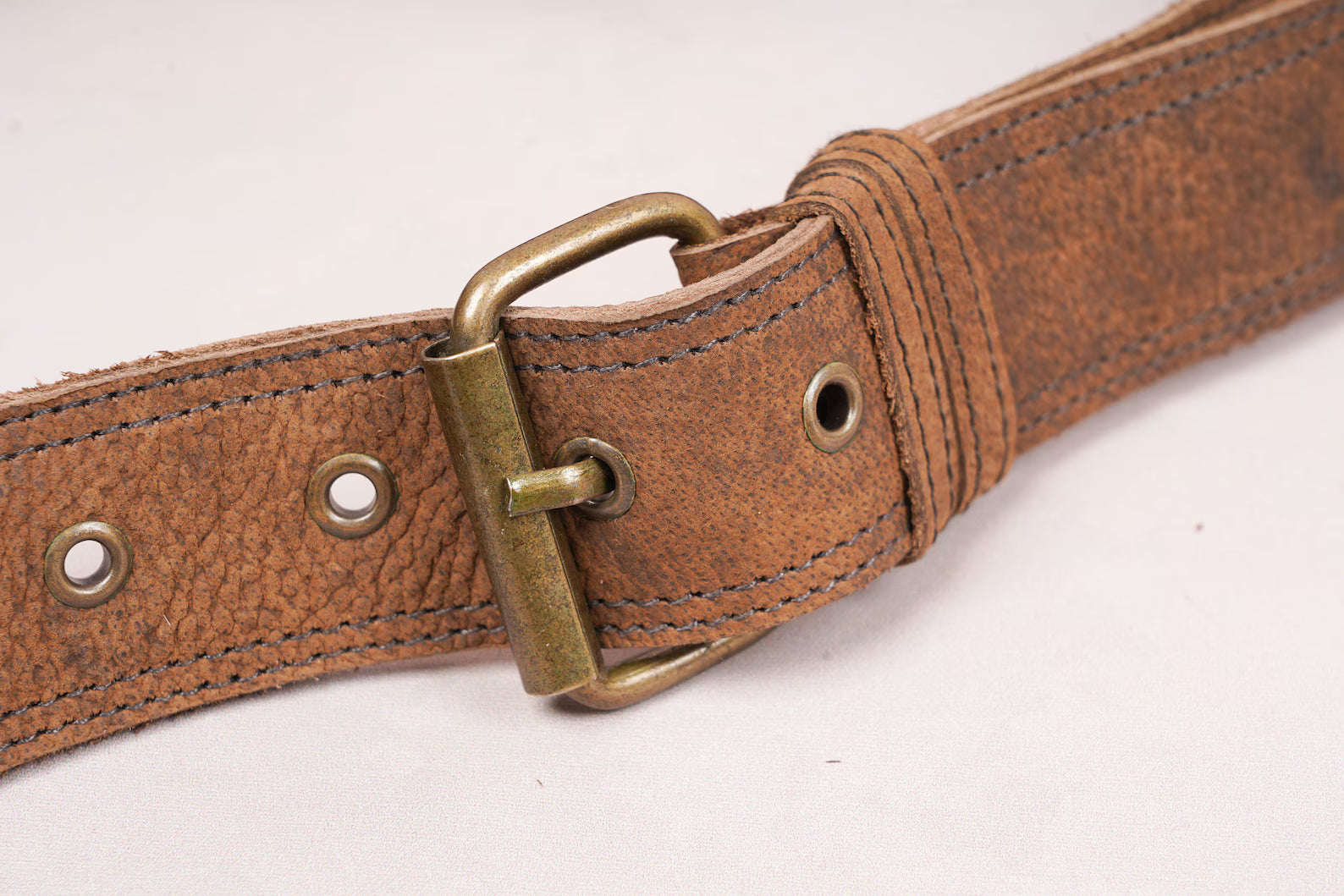 Minimalist leather belt bag with leg strap and front flap pouch