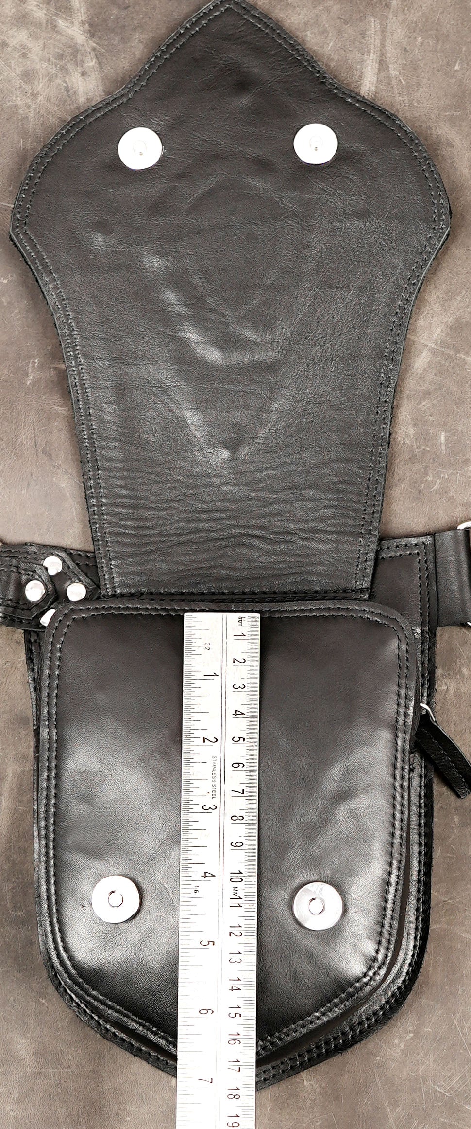 Genuine leather festival belt styled on stone background