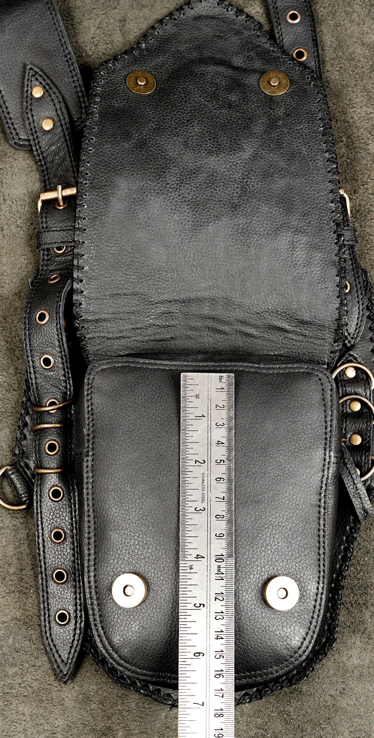 Genuine leather festival holster styled on suede background