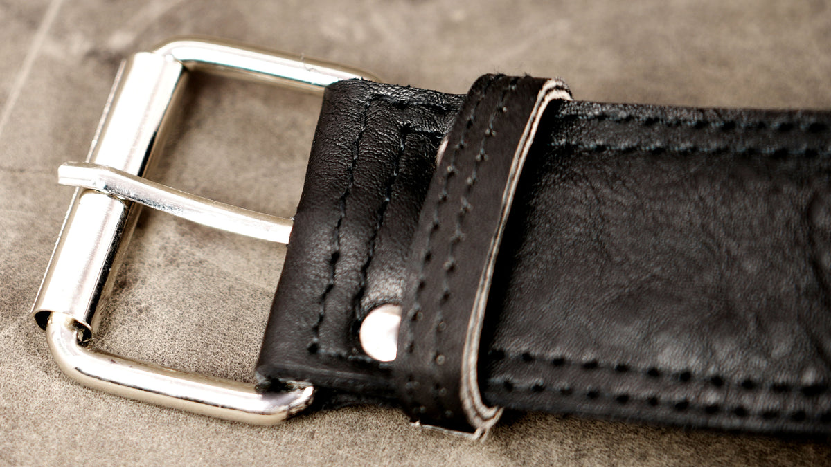Genuine leather waist bag styled on stone background