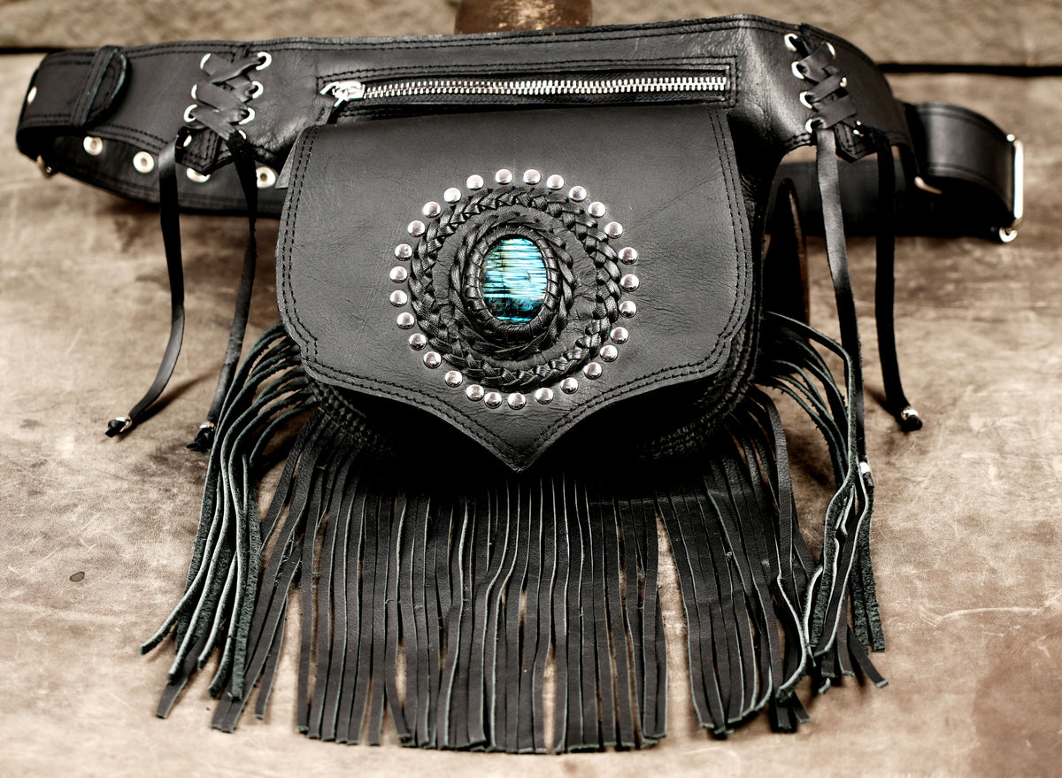 Western leather waist bag with long fringe, flat lay view