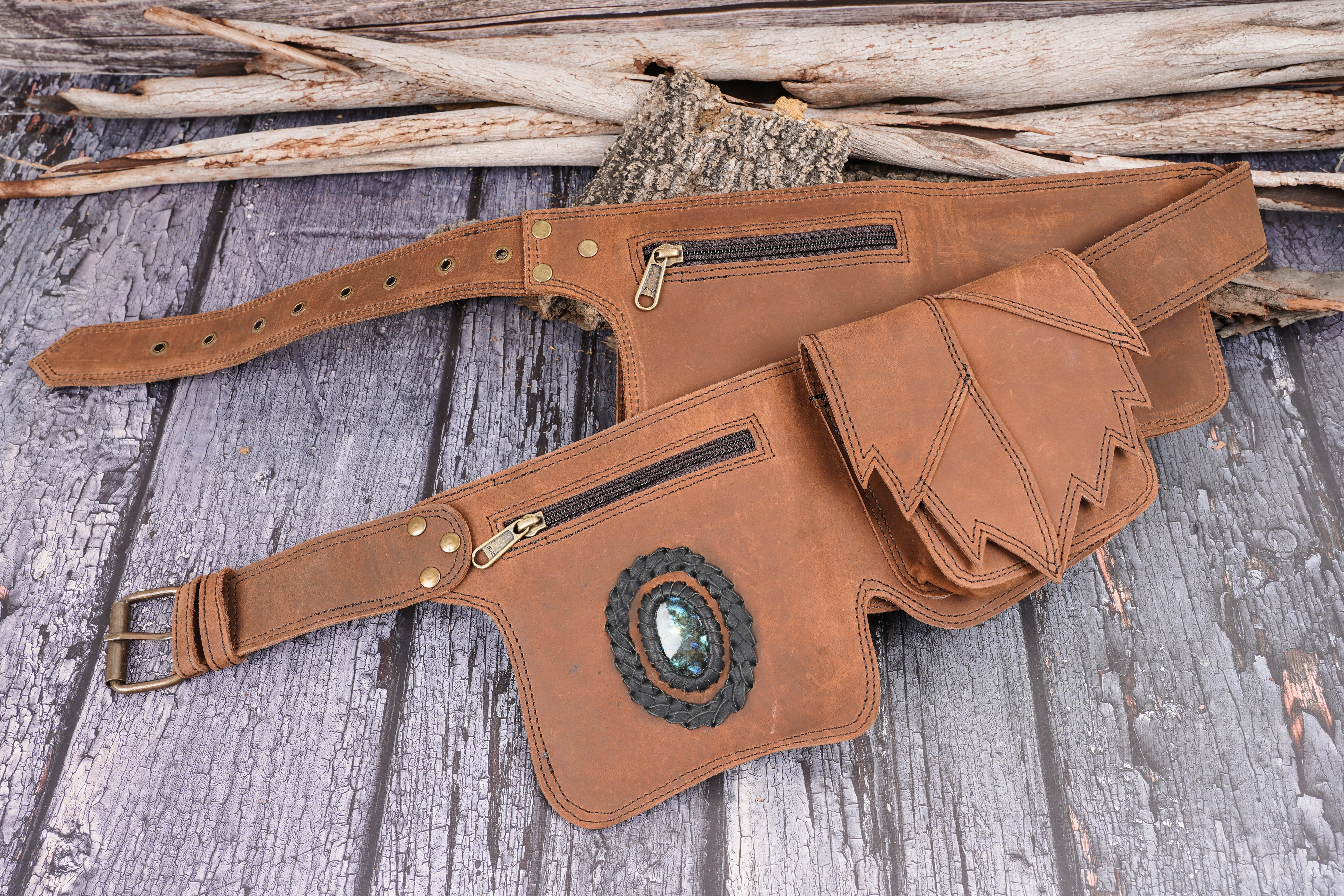 Leather belt bag with multiple compartments and buckles