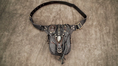 Boho style leather hip bag featuring a central teardrop gemstone and tribal stitching.