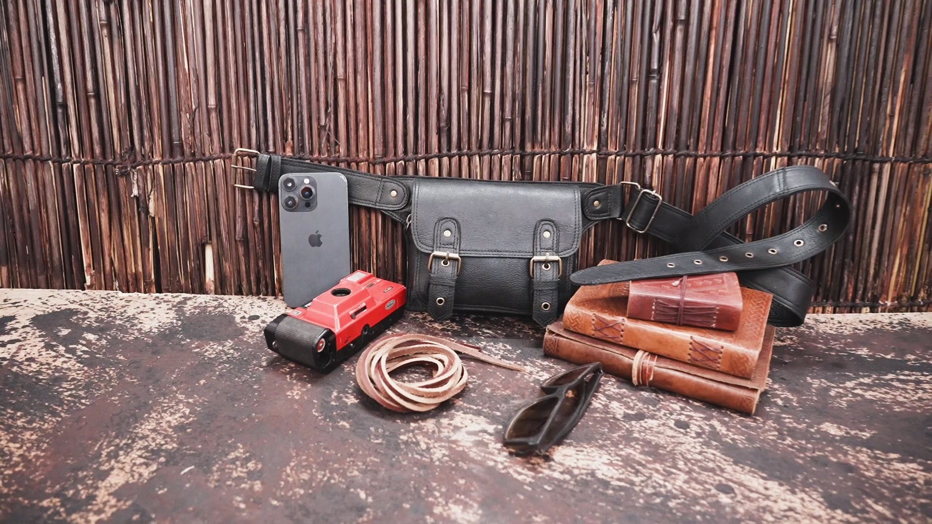 "Handmade black leather hip bag with adjustable strap"