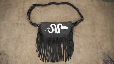 Black fringe utility hip pouch with white snake design for Burning Man accessories.