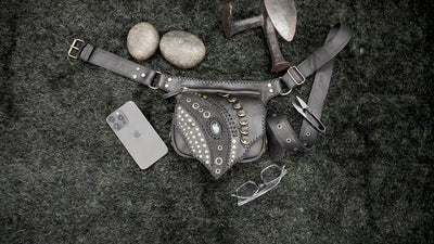 Handcrafted leather hip pouch with decorative metal detailing