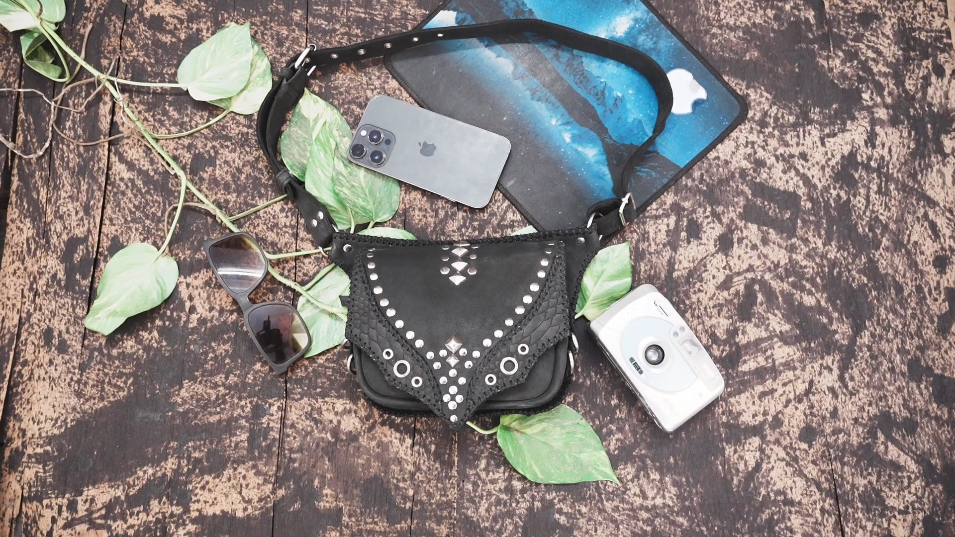 "Handmade studded leather hip bag with adjustable strap"