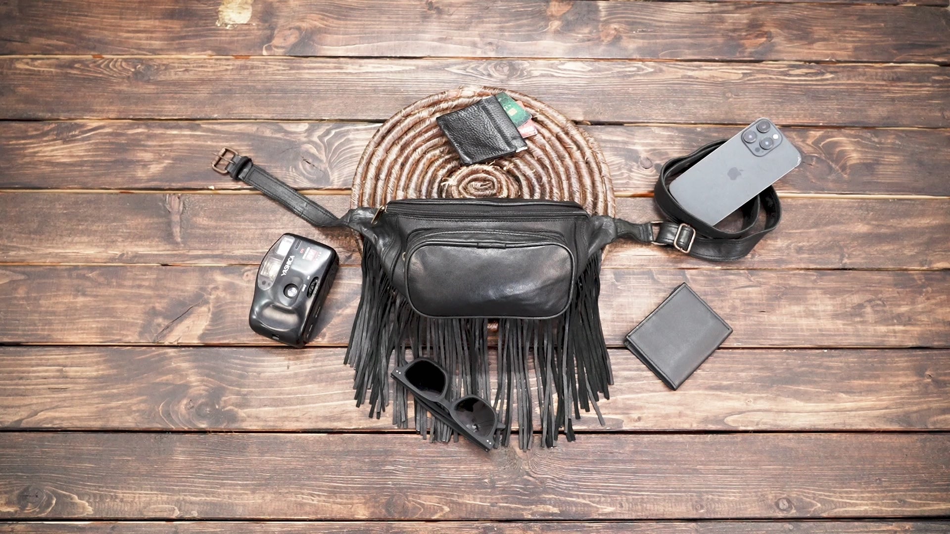Handmade black leather festival belt bag with fringe