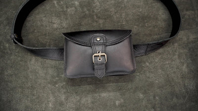 Unisex black leather bum bag with adjustable belt for everyday use