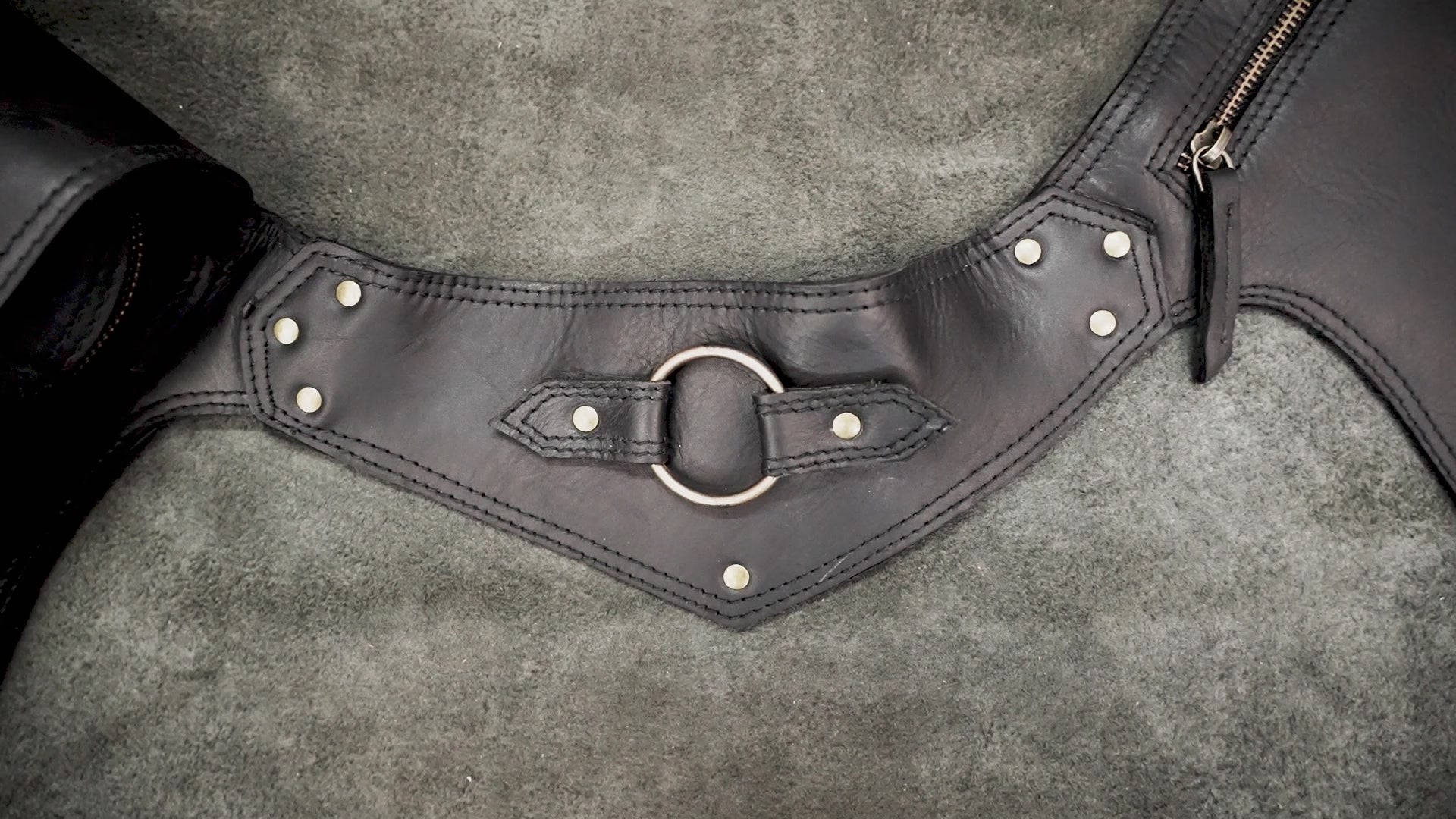 Leather utility belt worn on hip showing front pocket close-up