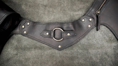 Leather utility belt worn on hip showing front pocket close-up