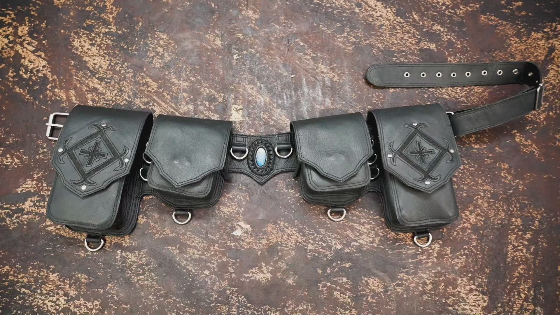 Black leather waist belt with metal ring details