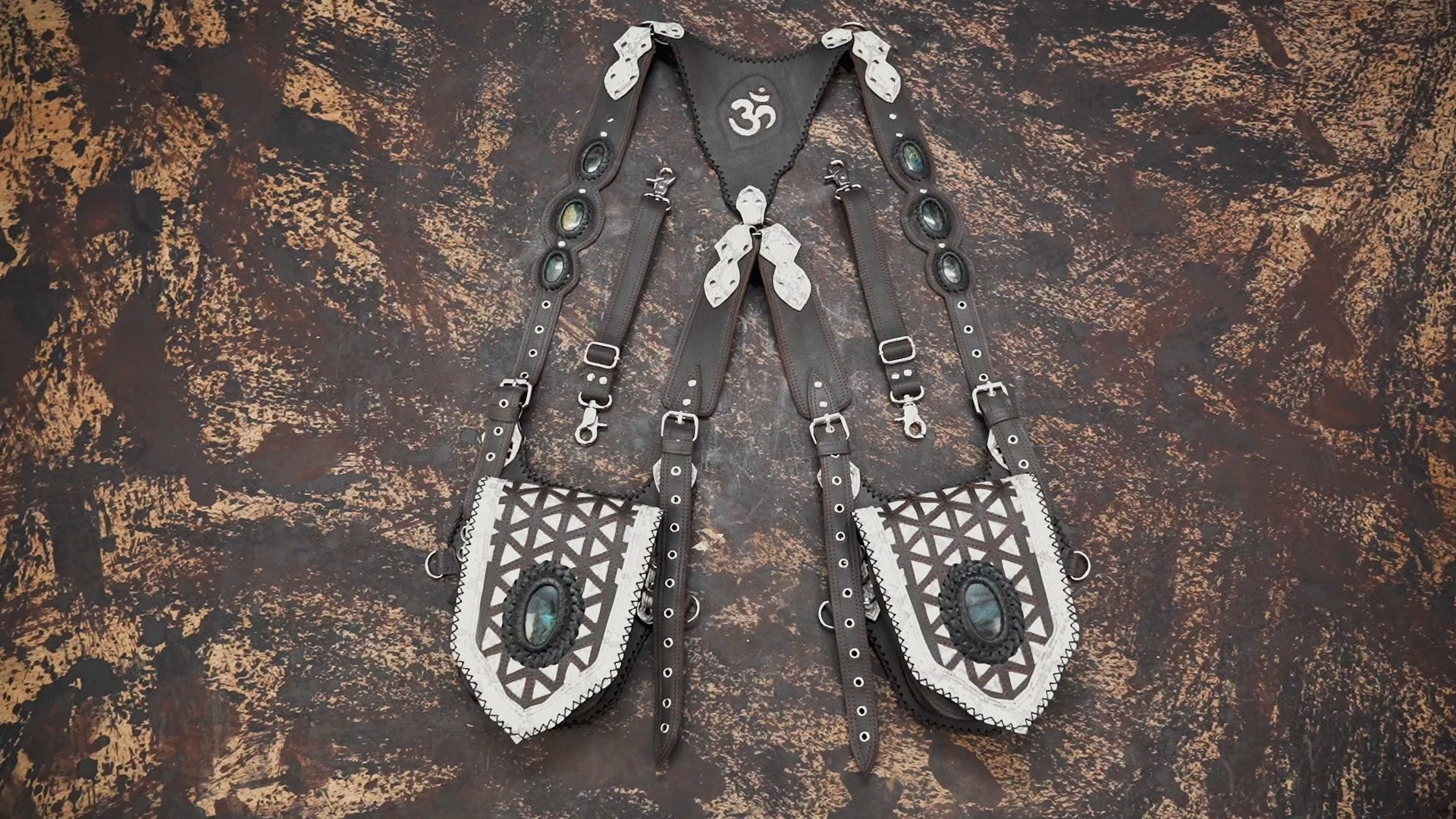 Artisan leather holster harness with tribal pattern and stone inlays
