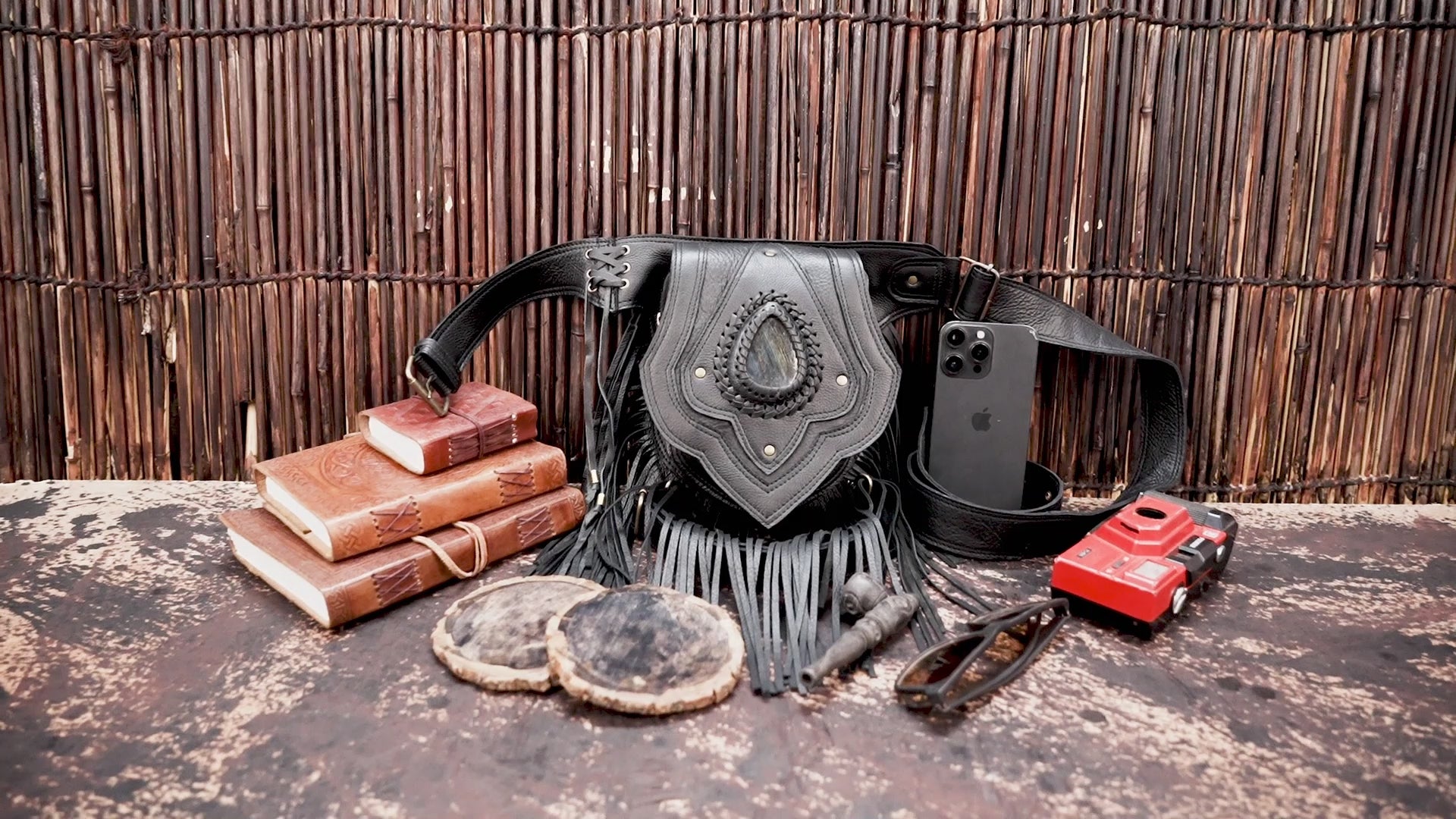 Handmade leather hip belt with long fringe and decorative stone