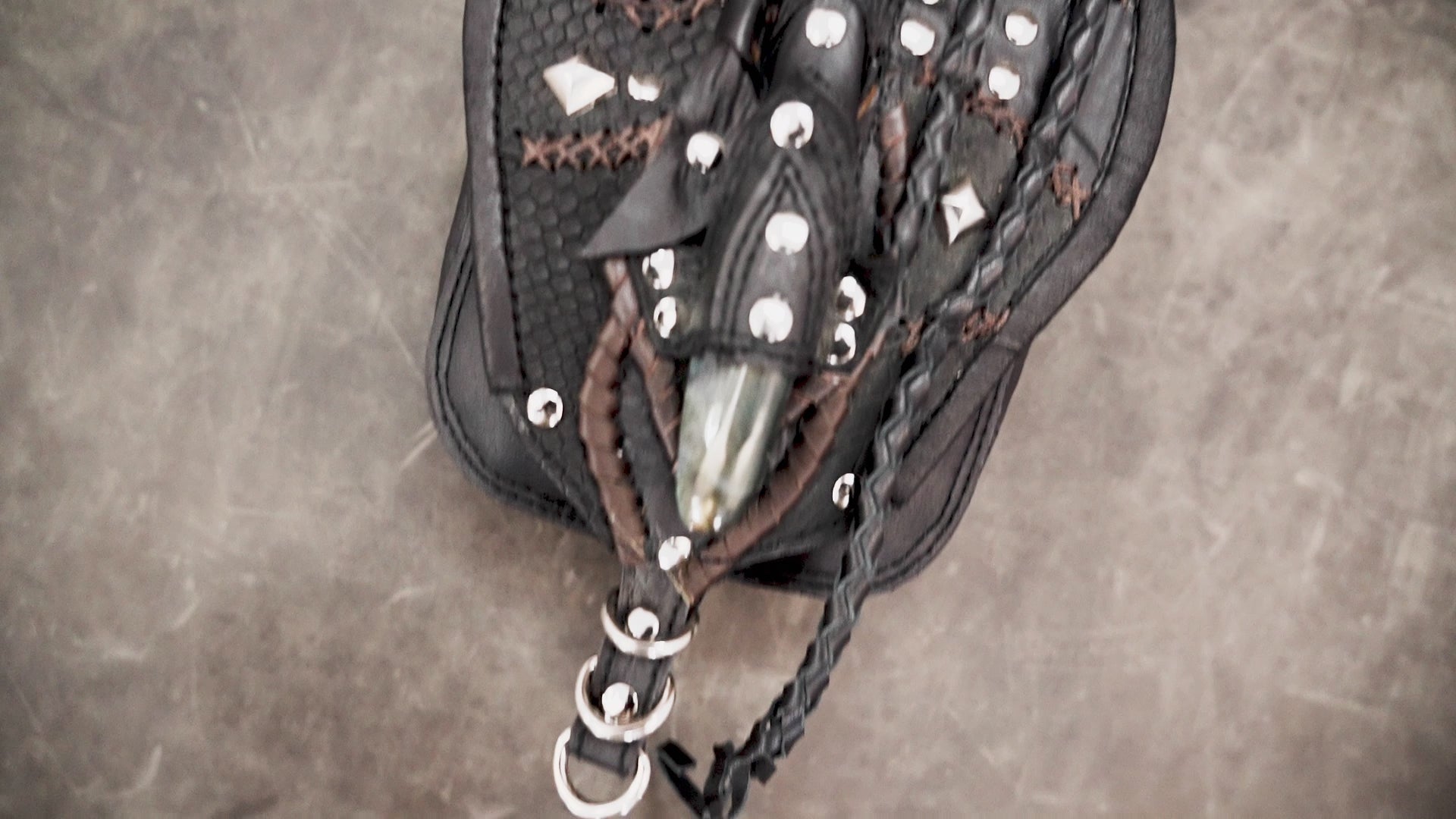 Adjustable leather belt pouch with silver rivets and artisan craftsmanship