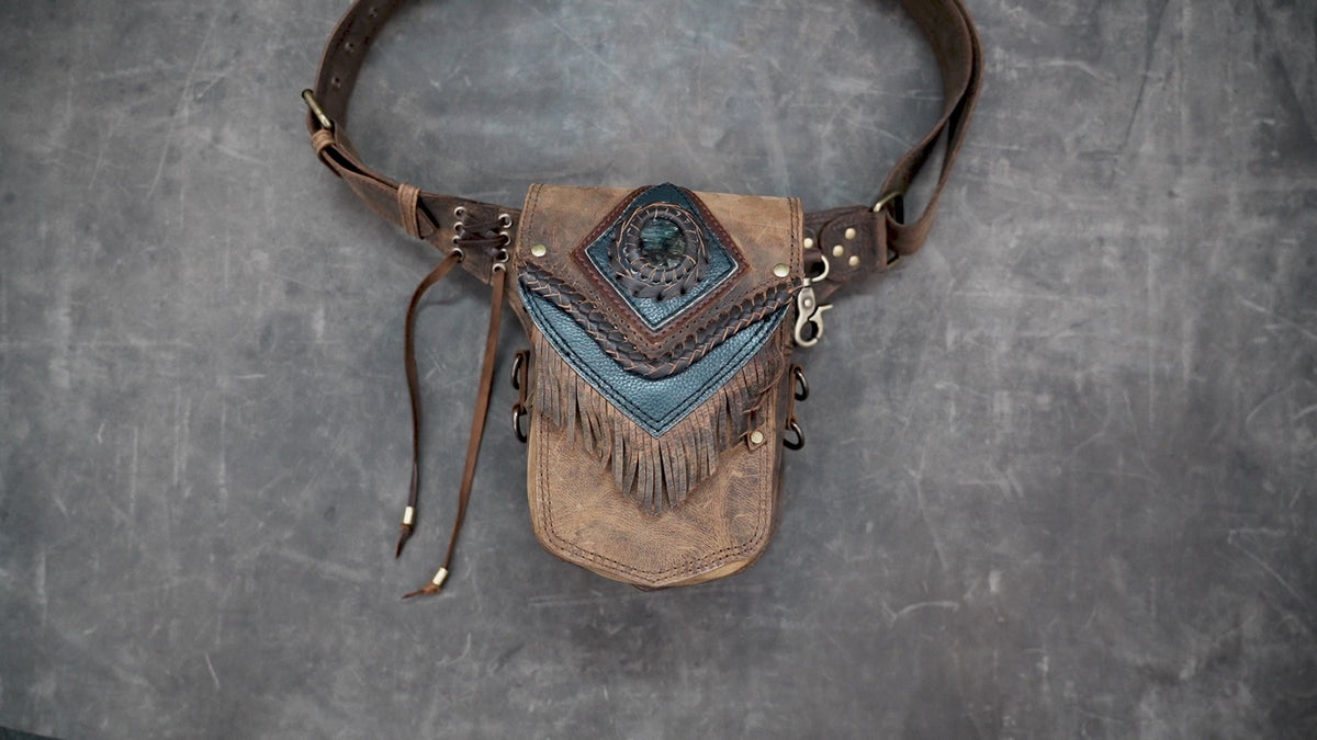 Boho leather hip bag with gemstone accent and decorative stitching
