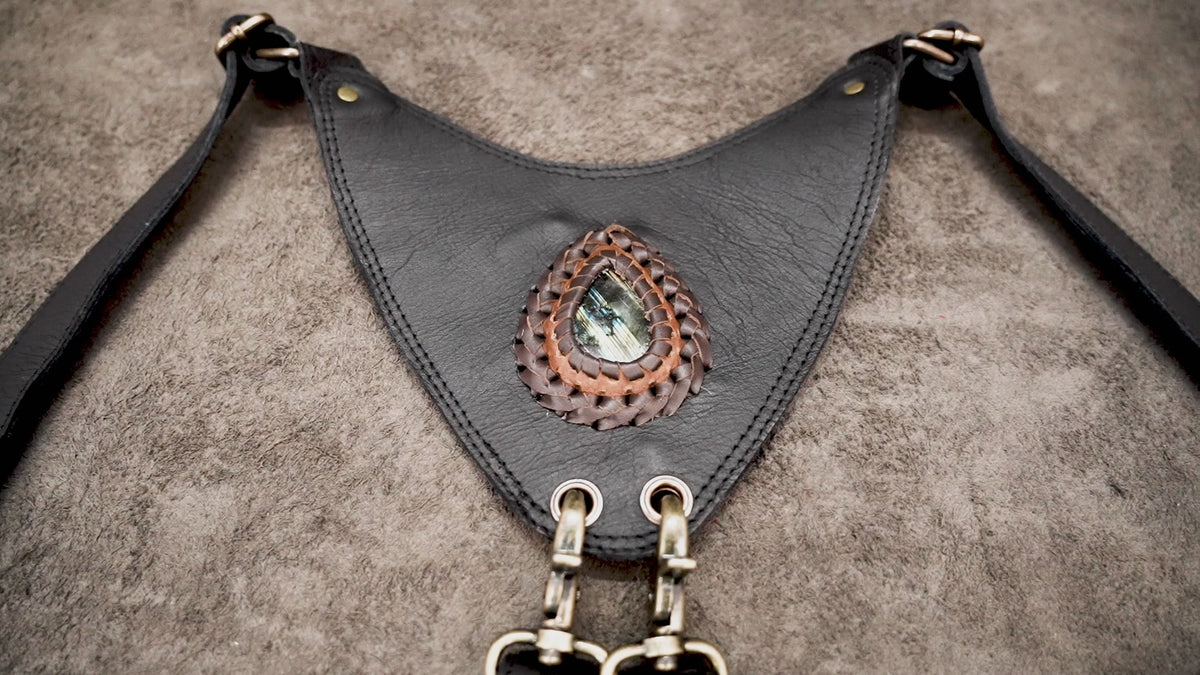 Black leather shoulder holster bag with adjustable buckle straps