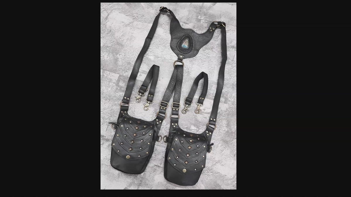 Black leather crossbody holster bag with multiple pockets and antique brass hardware