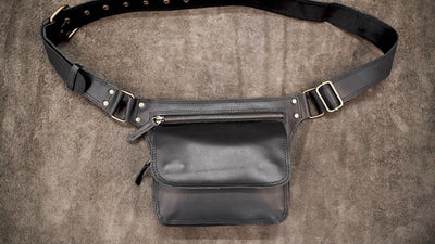 Black leather crossbody waist bag with snap flap