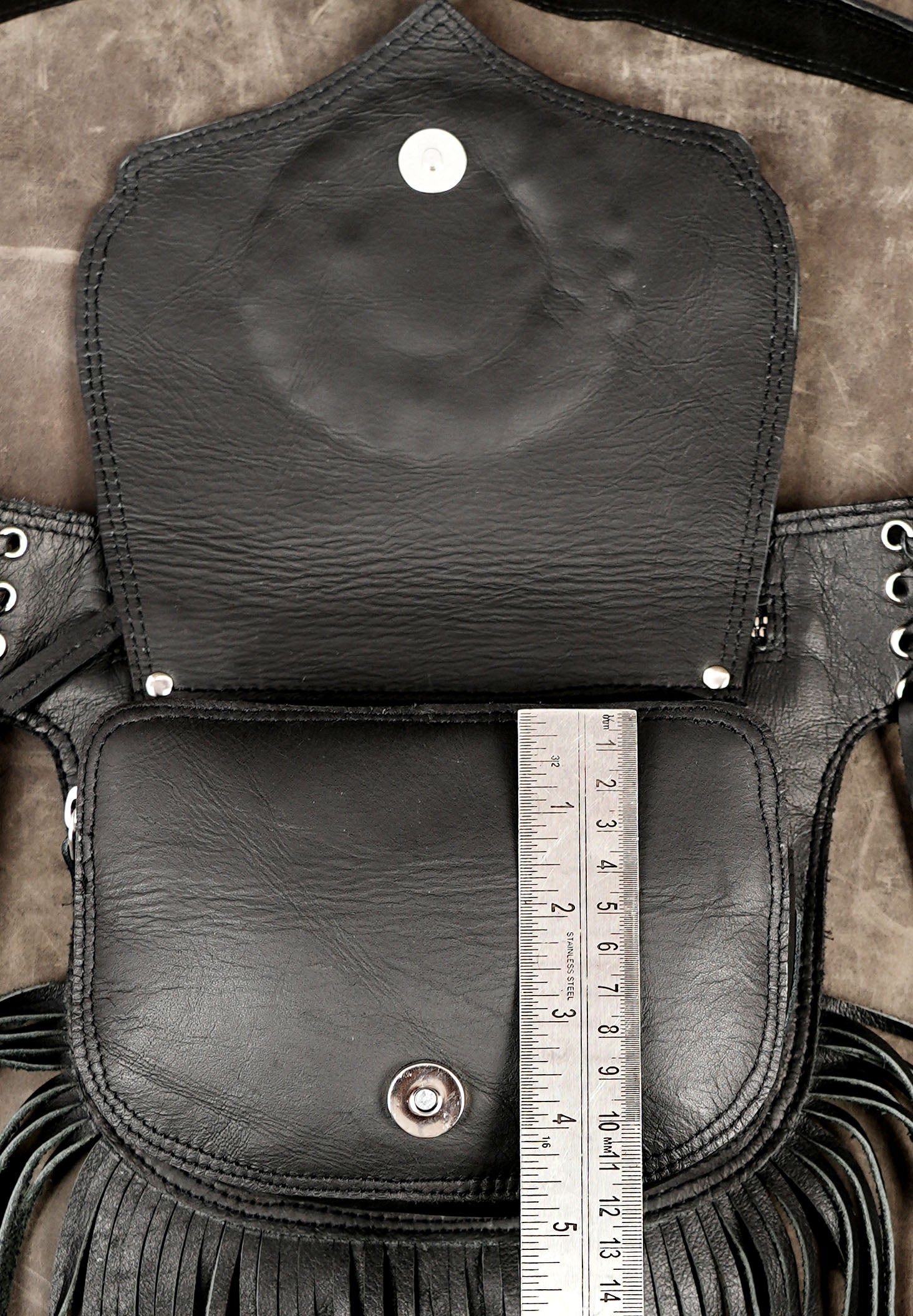 Cowgirl style leather bag with fringe and gemstone accent