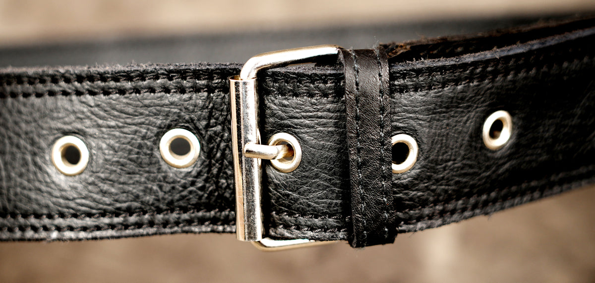 Genuine leather waist bag styled on stone background
